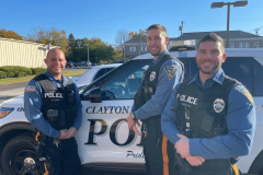 Clayton-PD-cops-by-car-min